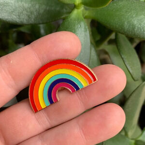 Brand new fun and bright enamel pin rainbow pride